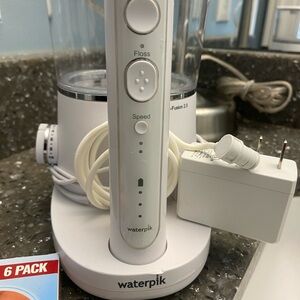 Waterpik Corded Water Flosser and cordless toothbrush. Handle & Base in White